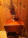 Early American tea cart; floral arrangement