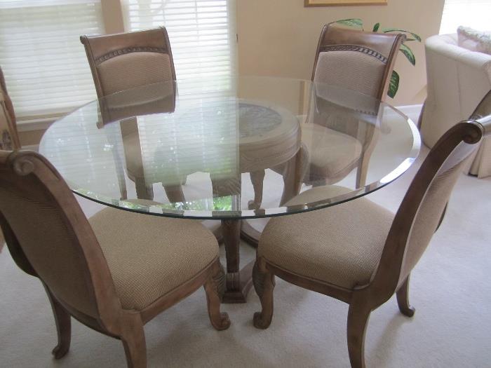 beautiful glass top table and 4 chairs