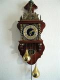 Zandaam Wall Clock w German movement. Made in Holland. Greek wtiting around Crown translates to Time flies, enjoy your Life. New replacement for this beautiful clock is $890.00 Dollars