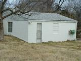 Side entrance/view of detached garage