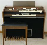 Baldwin organ w bench full of music
