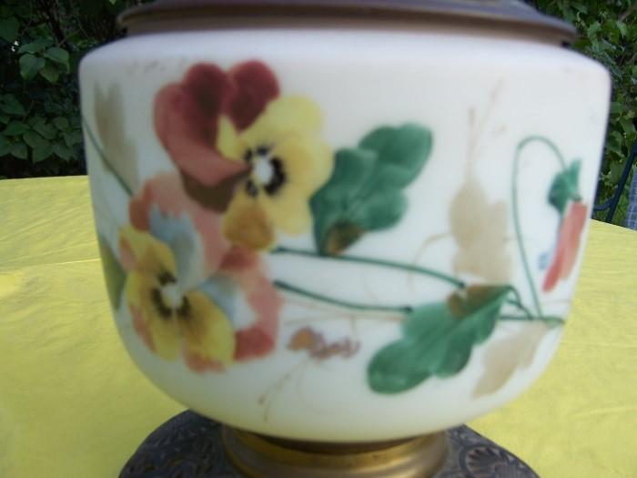 Hand painted flowers are feature on frosted glass.