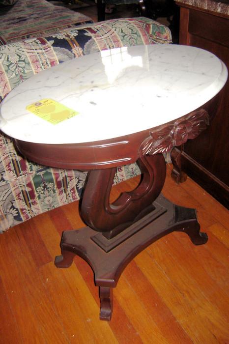 One of a pair of reproduction marble top end tables