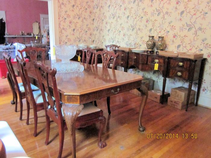 large dining table with large leaf & chairs and server in the back are part of set, sideboard