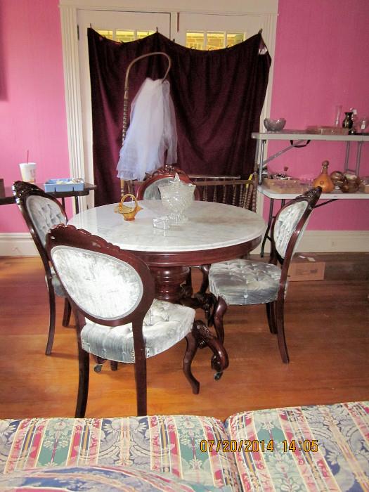 Reproduction marble top Victorian table & 4 chairs, cradle in rear