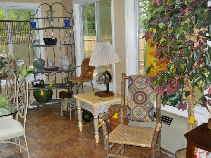 artificial tree, bark chair, hand-painted table, meter lamp, wicker bar stools, metal baker's rack, pottery, glassware, etc.