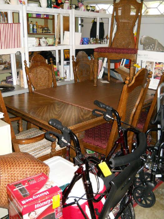 dining room table and 6 chairs, walkers, wheel chair, etc.