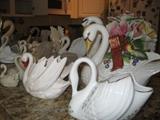a bevy of swans including a few made by Lenox and Fitz & Floyd
