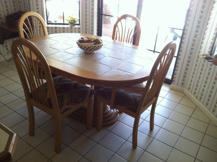 Tile topped dining table and four chairs