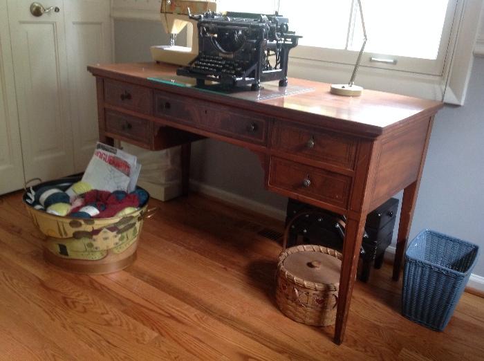 mahogany desk and typewriter