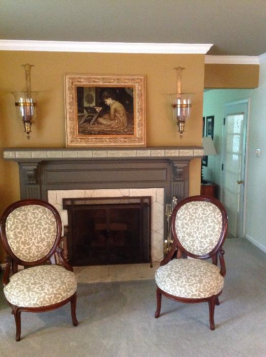 Reupholstered antique proposal chairs, mahogany. Brass candle sconces, painting.
