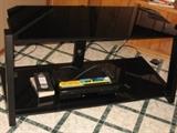 Black acrylic flat TV stand. 48 white, 22 deep, 22 tall.