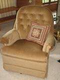 Light brown/tan fabric swivel chair.