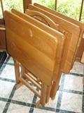 Four wood TV trays with stand.