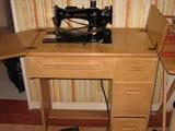 Mid century Singer sewing machine in wood cabinet