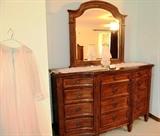 Continental Style Triple Dresser with Beveled Mirror, nicely sculpted, 12 drawers storage with brass pulls, walnut finish.  Dresser is part of Continental Style Bedroom Set that also includes Matching Queen Size Headboard, Queen Size Mattress & Boxsprings, 2 Matching Night Stands, and Large Wardrobes Armoire with beveled mirror door which are pictured elsewhere in this collection.