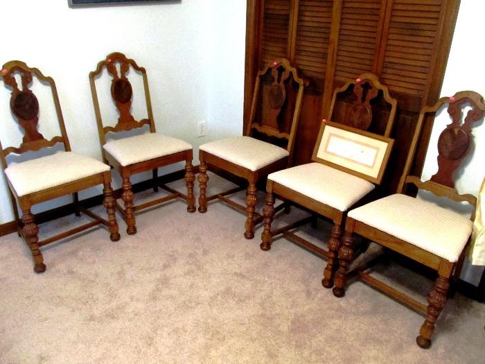 Set of 5 Vintage Splat Back Style Dining Side Chairs  with nicely carved backs and nicely spindled legs....Chairs have rich walnut finish and beige upholstered seats