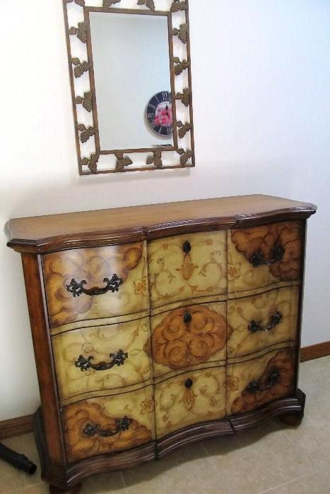Attractive Thomasville Sideboard / Chest of Drawers with faux and stencil accents, drawers storage with brass pulls, ...rich finish; Also shown is a nicely worked metal framed mirror. Mirror  Frame has floral accented borders