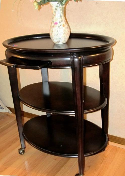 Vintage 3 Tiered Serving Cart on caster mounts, oval in shape and dark finish; Vase also shown is also available.