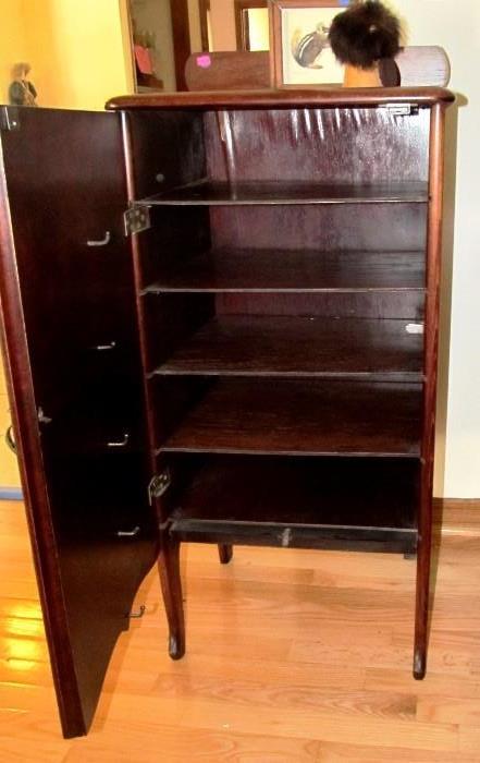 Open View of interior shelves storage for Vintage Victorian Style Record Cabinet with mahogany finish, brass pull.