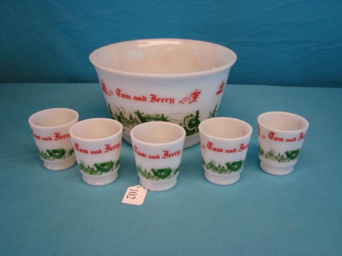Very nice white glass "Tom & Jerry" themed egg nog bowl with five glasses; Depicts scenes from the story. Boel measures 5 1/2" x 6", cups stand 3" tall.