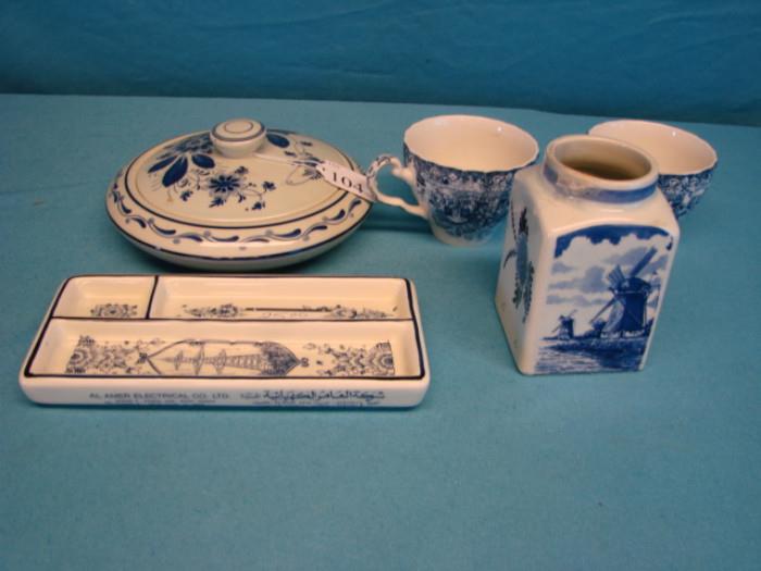 Includes: Two made in England tea cups, and three marked delft blue made in Holland porcelain dishes. Some pieces have some light crazing, no chips or cracks. Please see pictures.