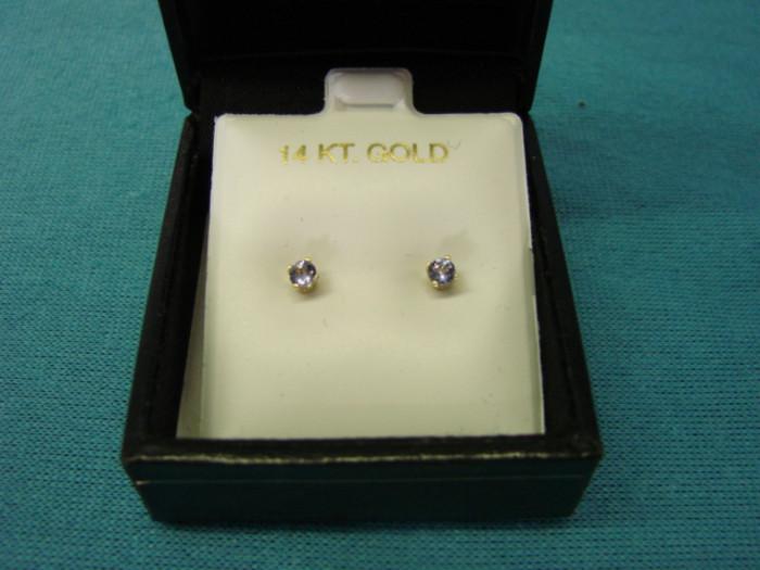 Beautiful pair of stud earrings; 14 karat gold with .25ctw tanzanite stones. In excellent condition. Please see pictures.