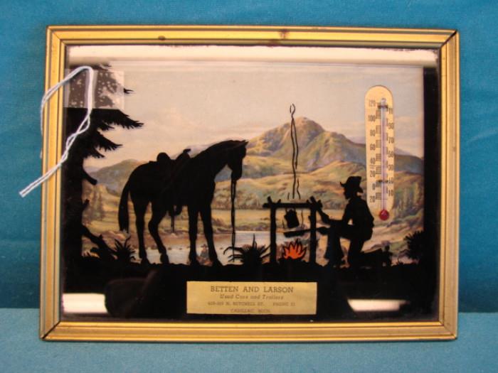 Very nice framed silhouette camping scene art/thermometer; Betten and Carson used cars, Cadillac, Michigan. Art by Donald Lund. Probably bought around 1946. Has very little wear, fantastic looking piece. Measures 8" x 6".