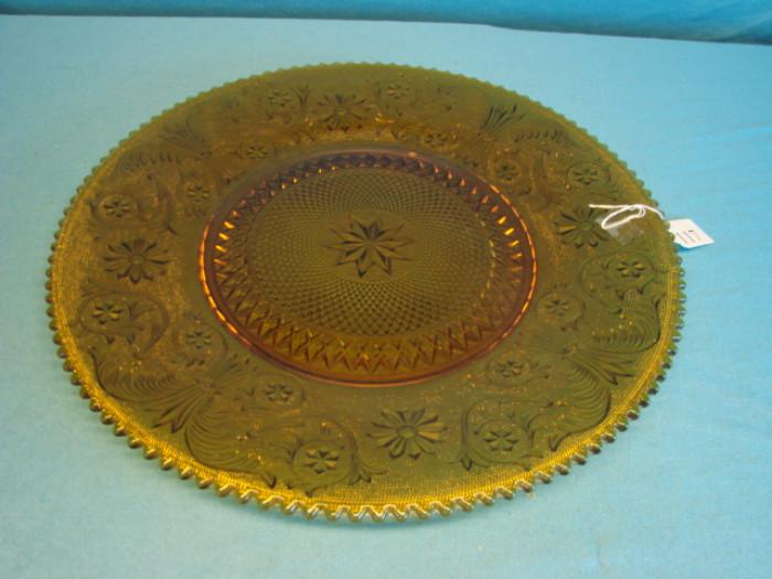 Beautiful amber glass cake plate; Very nice underside raised pattern, and deep, rich amber color. In excellent condition, no chips or cracks. Measures 17" across.
