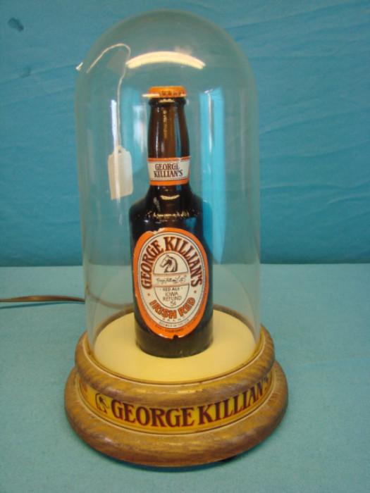 Very neat George Killian's beer piece; Vintage bottle of Killian's Irish red ale, with light-up stand, item is missing plastic globe. Has some light wear from age, scuffs/scratches, looks great. Stands 18" tall.