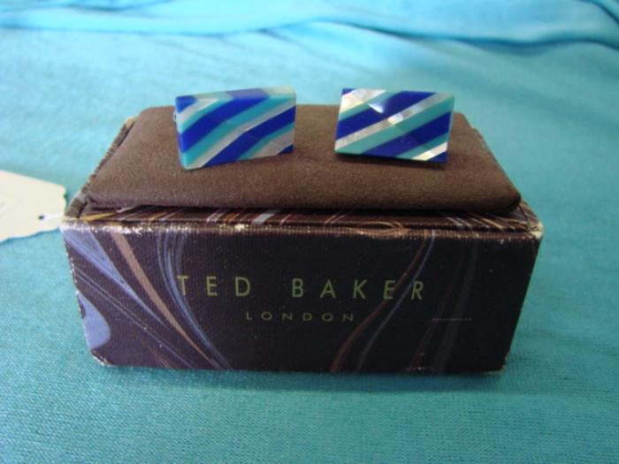 Very refined looking designer cufflinks, by Ted Baker, London; Interesting mother-of-pearl, lapis and stone construction. Cufflinks look like they've never been used, and come with original display box. Each cufflink measures 3/4" across.
