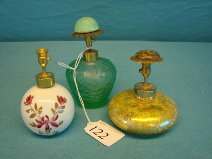 Three very nice antique perfume bottles; All are atomizers with press tops. One porcelain, marked "Germany US Zone", one made from crackle glass, and one green glass, marked "I. Rice Japan".