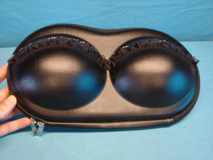 In MINT condition, "The bra bag" zip-up bag. Measures 13" across.