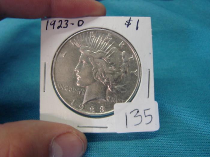 1923-D Peace silver dollar. Please see pictures for accurate grading. Visit www.AuctionNV.com