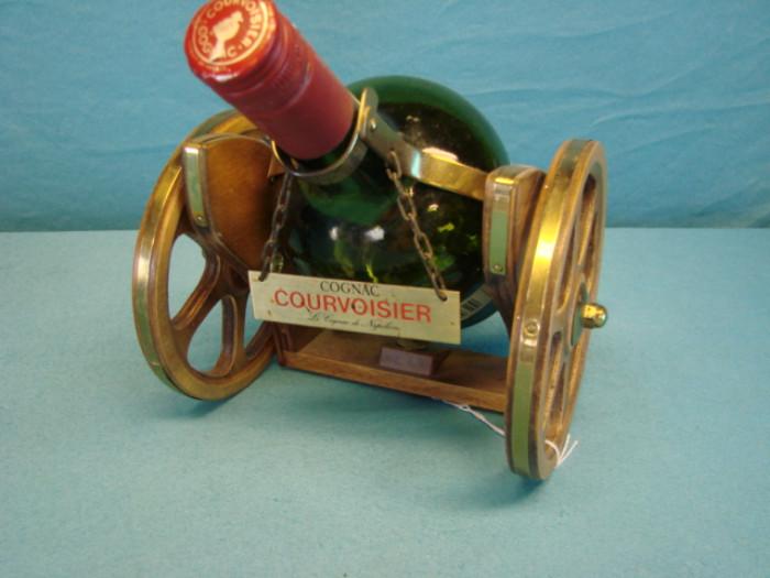 Vintage Courvoisier VS (Very Special) cognac bottle, comes with a Courvoisier wood and metal decorative cannon holder. In excellent condition, stand has some light wear, please see pictures.