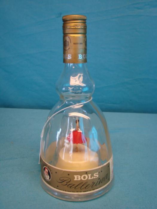 Bol's ballerina bottle; Apricot liqueur bottle, made in France. Music box plays "Le Bleu Danube". Ballerina in center spins and dances. Bottle has some very light wear, marks on glass, in overall great condition. Stands 9 1/2" tall.