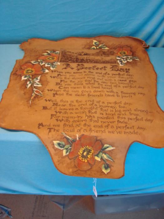 Very nice hand-painted and hand-tooled piece of hide; Beautiful wall hanging engraved with the poem "A Perfect Day". Measures 31" x 24". Has some curling around the edges, in very good to excellent condition. Please see pictures.