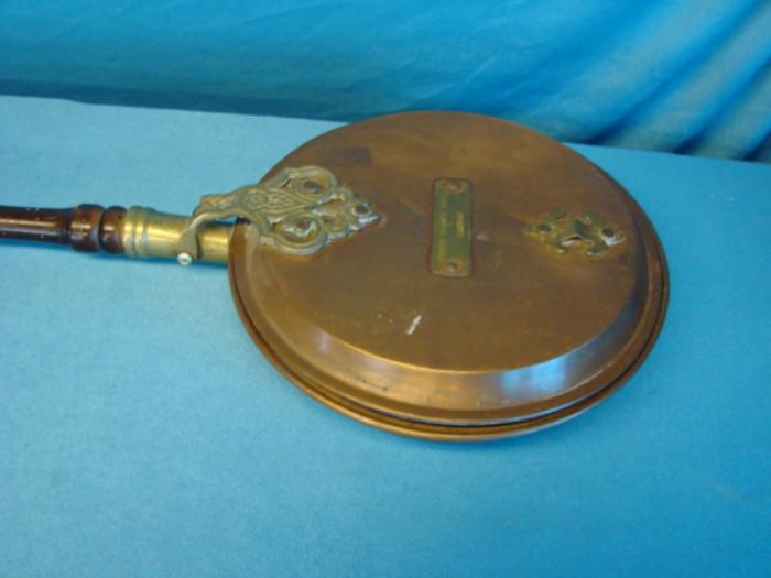 Very rare copper bed warmer, from the Prince George Hotel in London, circa early 1900's; Very nice copper and wood construction, has scuffs and paint loss on handle, copper is very clean, minute oxidation, handle has become loose, in excellent condition for age. Measures 39" long.