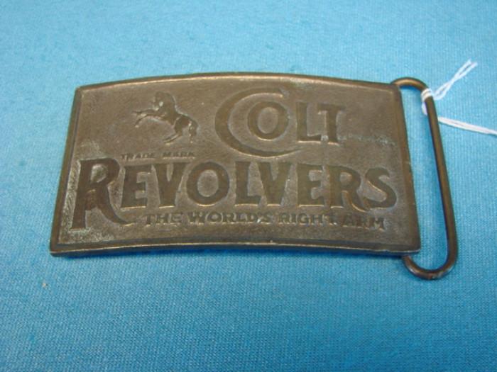 "Colt Revolvers" solid bronze belt buckle. Rare, unique piece, made by Tiffany & Co., New York City, USA. Marked "Rare Stones". In very good condition, has some light wear from being worn, light dents along the edges, and some very light oxidation. Buckle measures 4" x 2 1/4"