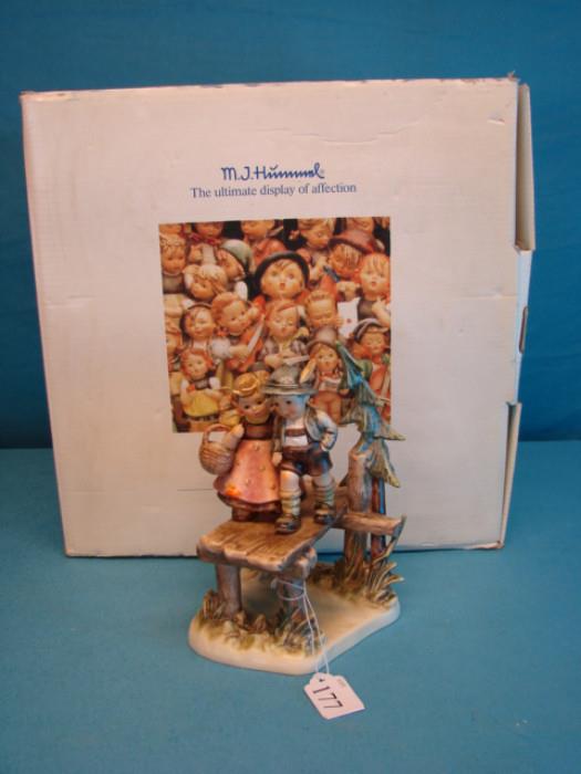 Beautiful Goebel M.I. Hummel century collection figurine, "On our way"; Piece has special backstamp. Figurine is in excellent condition, has virtually no wear, box has some light wear from shelf life.