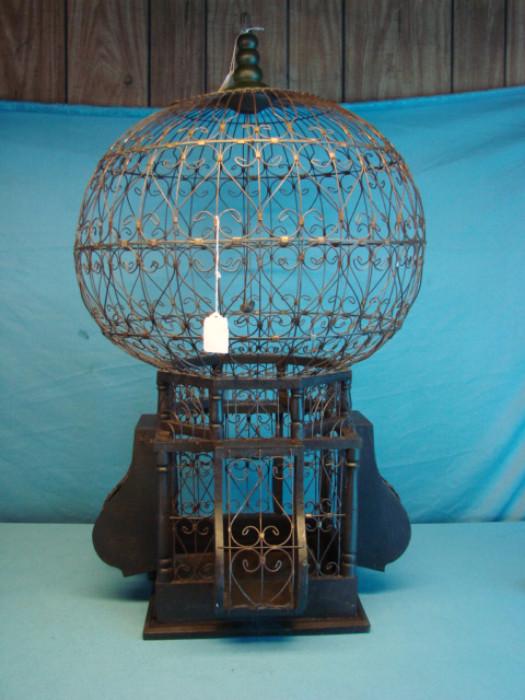 Very neat folk art decorative Victorian-style "Wire Ware" bird cage; Very intricate wire construction. In excellent condition. Cage measures 34" tall.