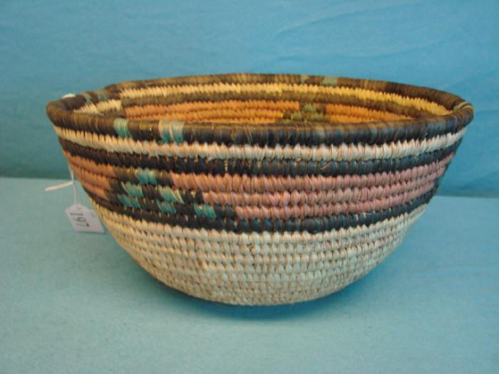 Hand-woven, coil style tribal basket; Measures 11 1/2" x 5 1/2" Visit www.AuctionNV.com