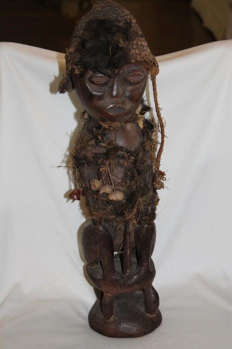 From central Africa - ceremonial wood carved figure.  Over 100 years old - this one represents a government official.  Authentic bone and teeth.  "Village made" not mass produced!