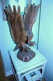 Large carved eagle and wicker table