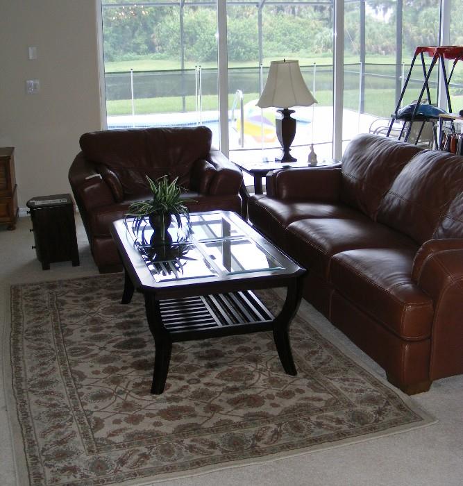 leather sofa and chair,  coffee and end table