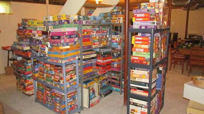 MOUNTAINS OF ASSORTED JIGSAW PUZZLES