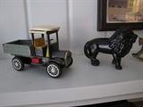 Antique truck and cast iron lion bank