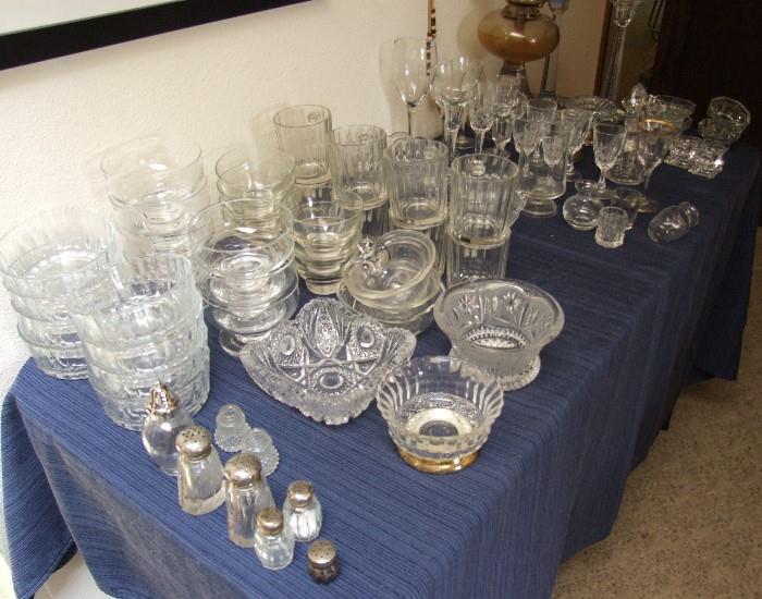 LOTS OF CRYSTAL & GLASS SERVING PIECES, CANDLE HOLDERS, S & P SHAKERS, OIL LAMP, ASSORTED GLASSES, SHERRY BEVERAGE WARE.