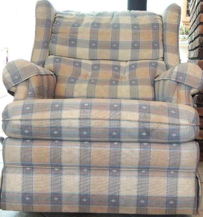 One of a pair of traditional plaid rockers.