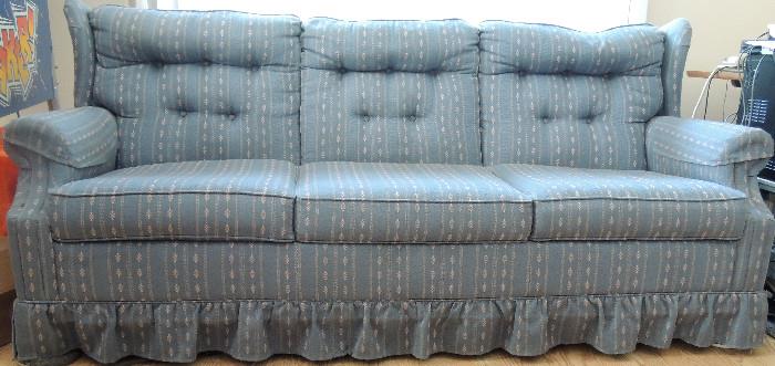 Blue upholstered sofa.